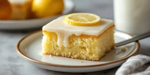 Lemon Poke Cake with Pudding Mix for Extra Moist Texture